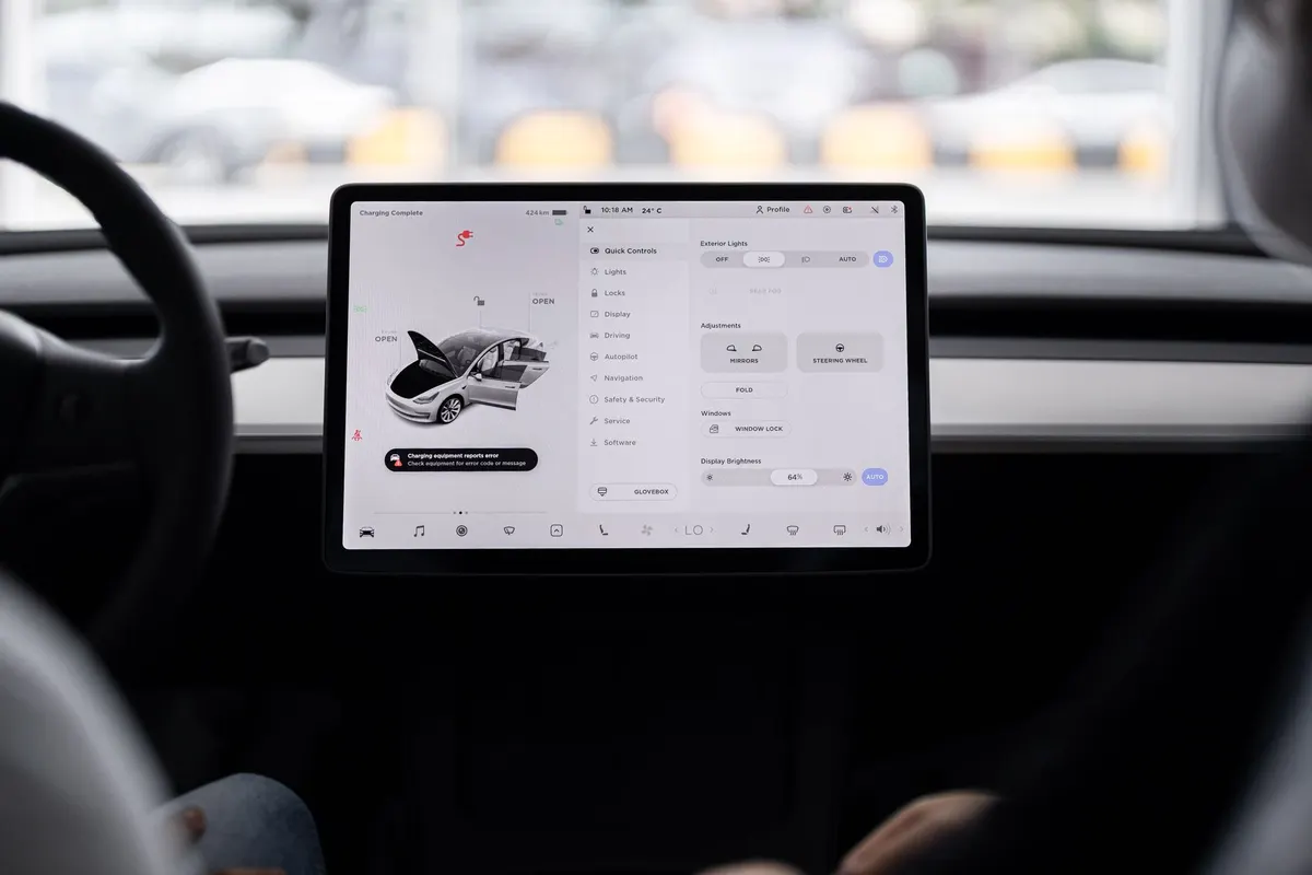 View of a modern car's dashboard featuring a digital display panel with control options.