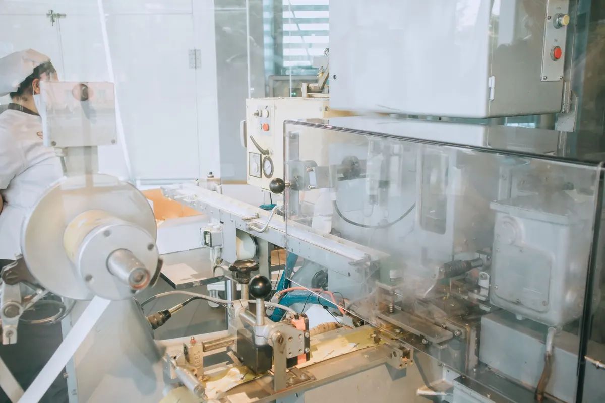 Close-up of advanced machinery in a modern laboratory setting, highlighting technology and industry.
